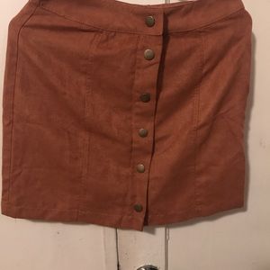 Suede camel mini skirt. Button up